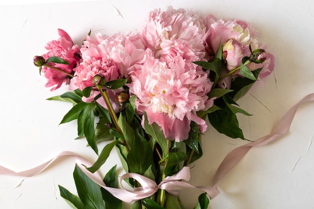 Top view peony flower with leaves