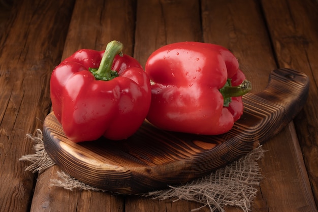 top view pepper on wooden board