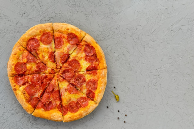 top view pepperoni pizza on table