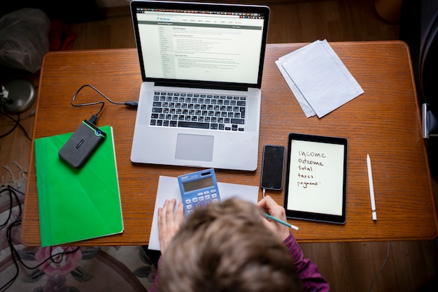 Top view of person starting new business plan at home