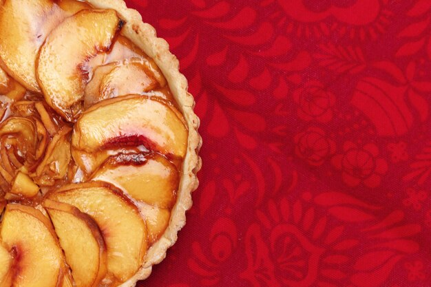 Top view photo of apple tart pie on tablecloth