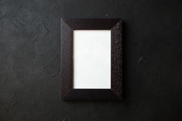 Top view of picture frame on dark wall