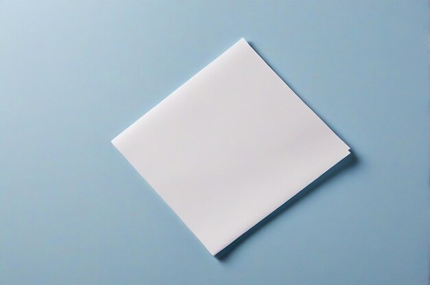 Top view piece of paper on blue background