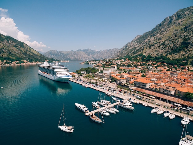 Top view of the pier with a big boat and town