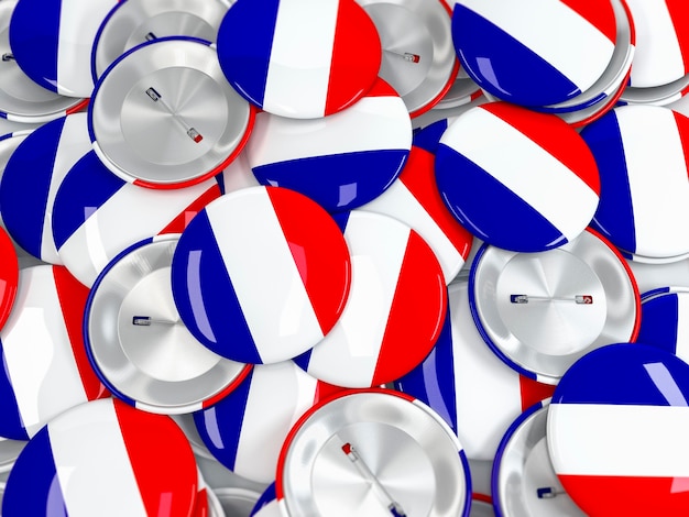 Photo top view on pile of button badges with flag of france. realisitic 3d render