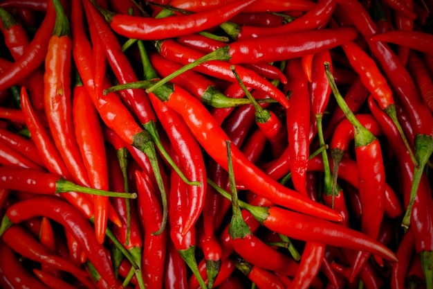 top view of a pile of fresh chili and ripe red peppers Background textures or templates to simulate