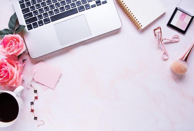 Top view, pink color office desk.