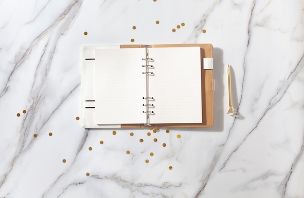 Photo top view pink notebook on desk