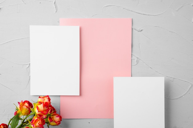 Top view of a pink paper letter and flowers with copy space