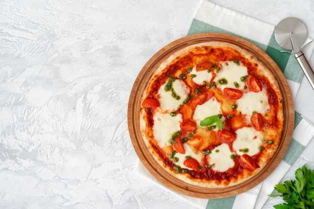 Top view of pizza Margherita on gray surface table