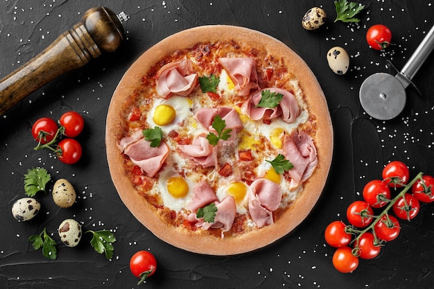 Top view of pizza with quail eggs and ham