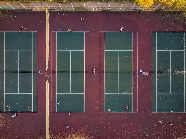 Top view play tennis on several courts aerial drone shot