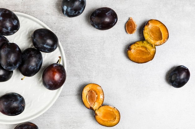 Top view of plums on wooden backgruond