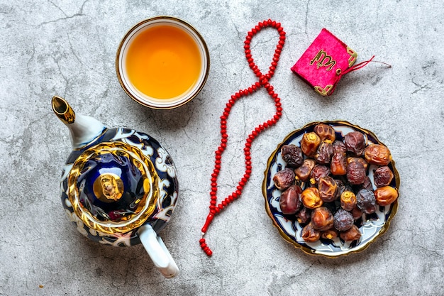 Top view popular food during Ramadan on concrete background