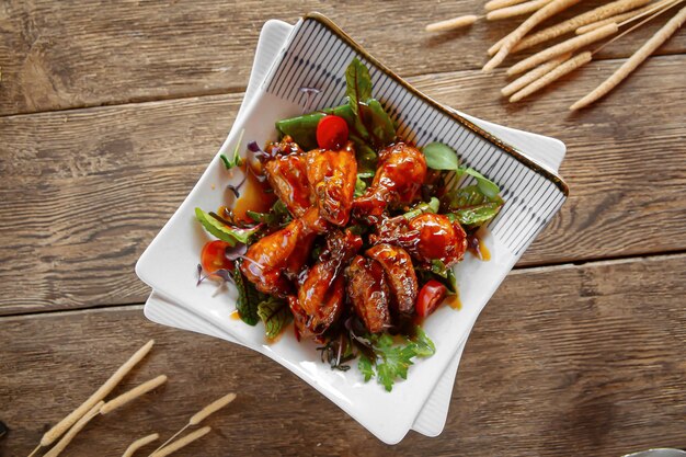 Top view on portion of glazed chicken wings