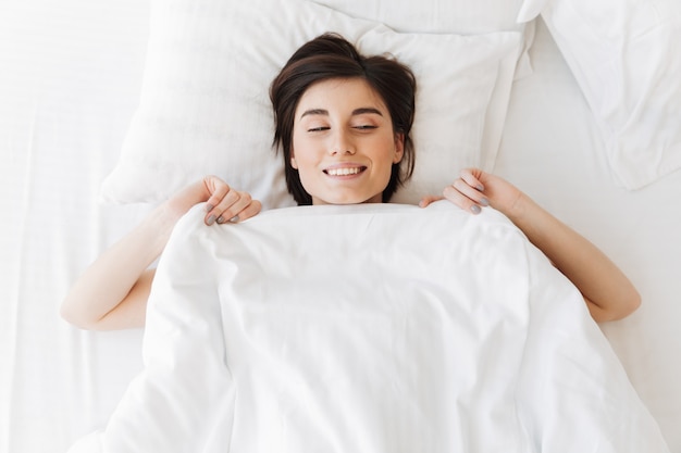 Top view portrait of a satisfied young woman