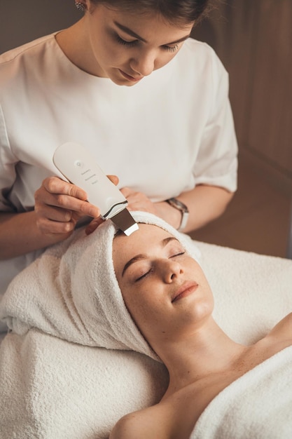 Top view portrait of a woman in spa salon getting face treatment Spa treatment Attractive elegant woman Beauty woman body Health care beauty treatment