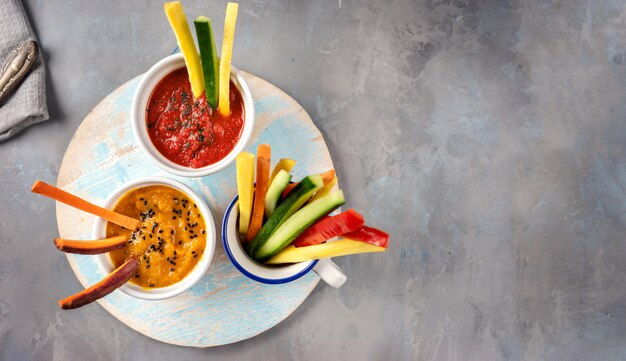 Top view of pumpkin dip with coroful vegetable sticks