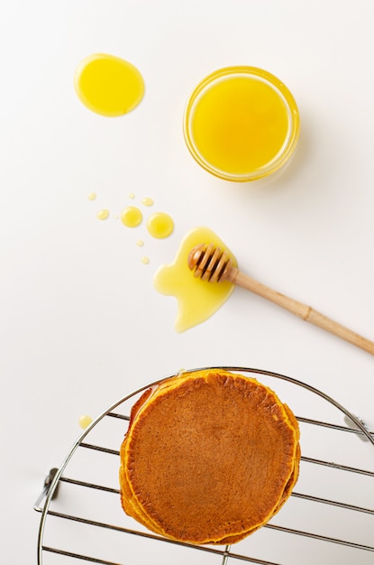 Top view of pumpkin pancakes on white