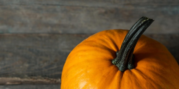 Top view pumpkin on wooden texture background