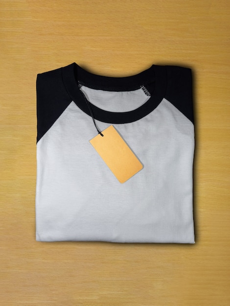 Photo top view raglan sleeve t-shirt with tag price