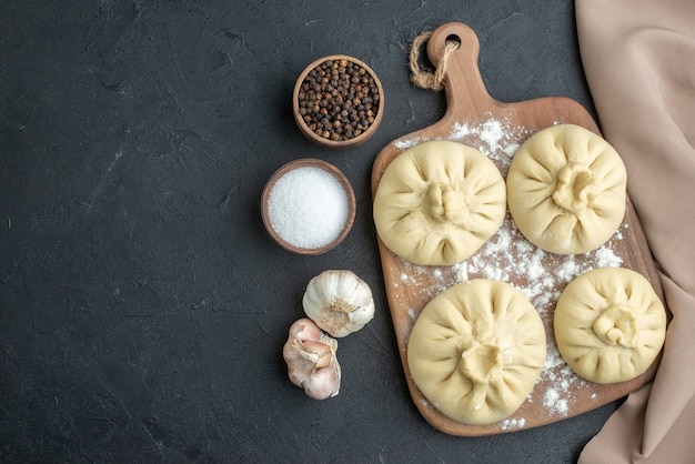 top view raw dumplings over cutting board