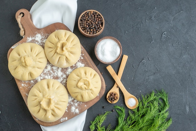 top view raw dumplings over cutting board