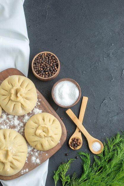 top view raw dumplings over cutting board