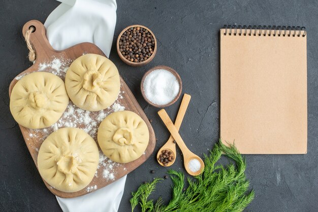 top view raw dumplings over cutting board