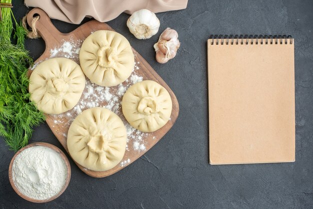 top view raw dumplings over cutting board