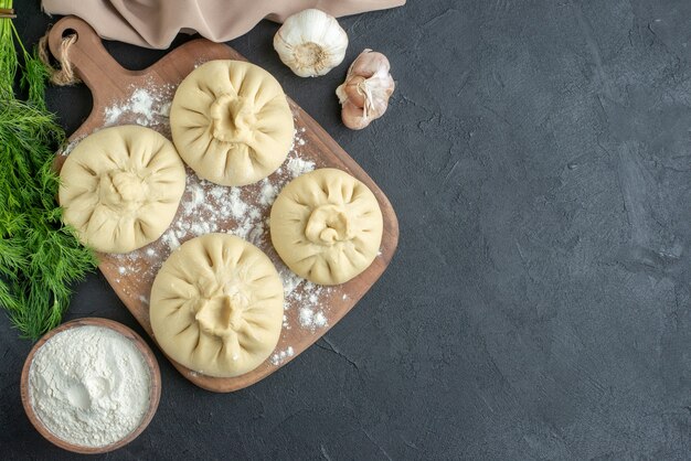 top view raw dumplings over cutting board