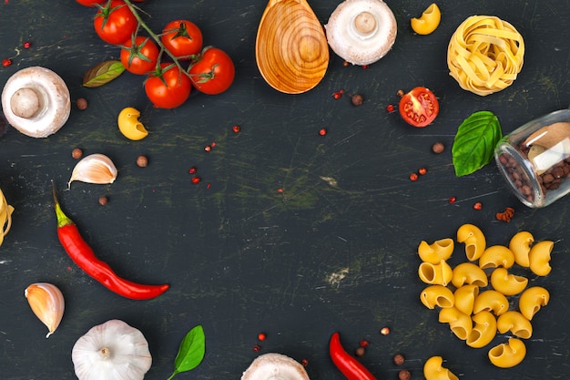 Top view of raw Italian pasta with ingredients