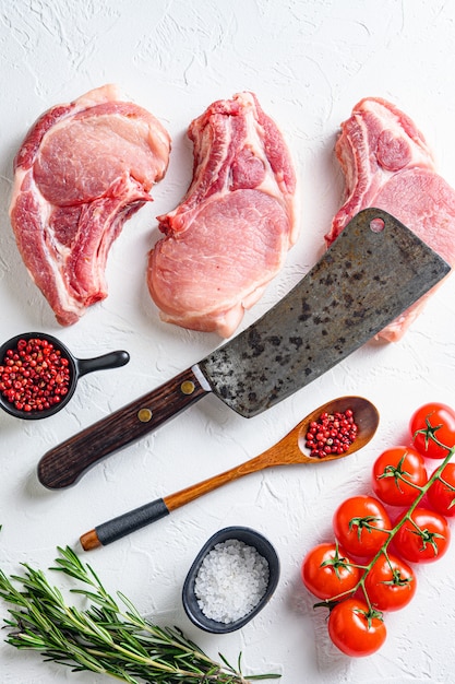 Top view of raw organic pork chop steak with ingredients