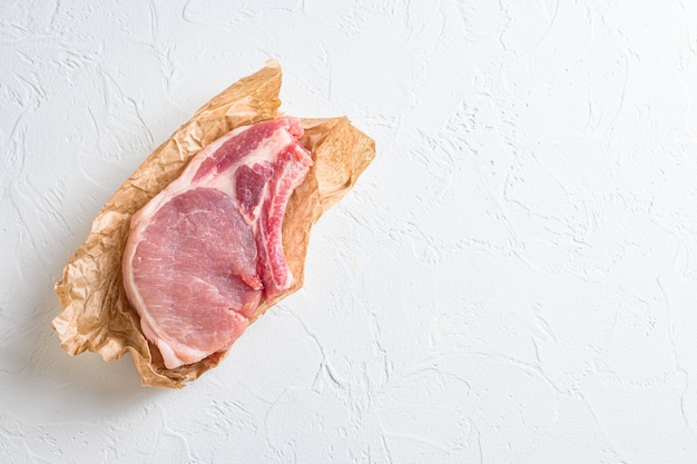 Top view of raw organic pork chop steak