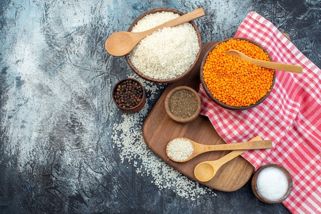 top view raw rice with orange lentils and seasonings on dark background seed cereal color meal food soup