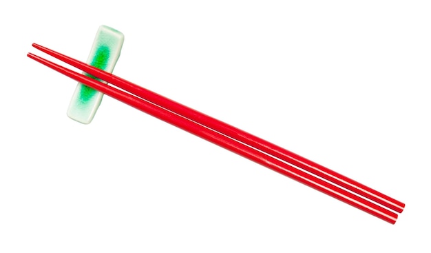 Top view of red chopsticks on chopstick rest