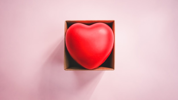 Top view of red heart in the paper brown box