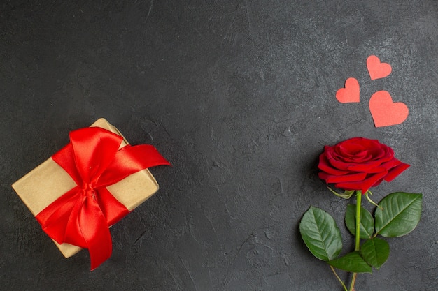 top view red rose with present tied with red bow on a dark background love couple passion valentines day color heart marriage