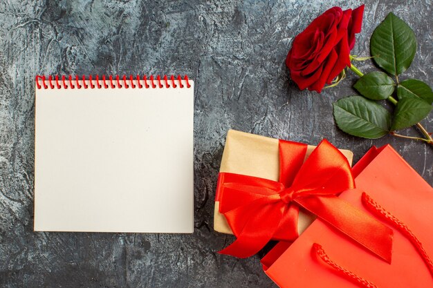 top view red rose with presents for valentines day on a light gray background couple marriage passion heart feeling love holiday