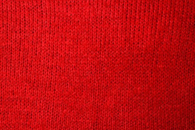 Вид сверху красный тонированный абстрактный текстильный фон текстуры