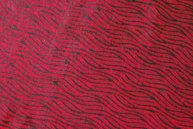 Top view red toned abstract textile texture background