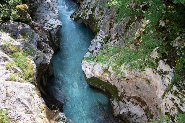 Top view of river soca flowing fast through big gorge