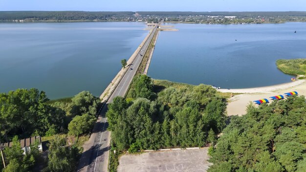 Top view of the road on the dam across the river