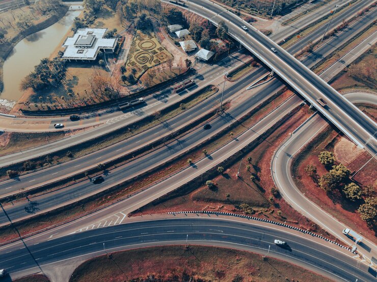 Photo top view of the road runway through the green aerial view car truck drivers