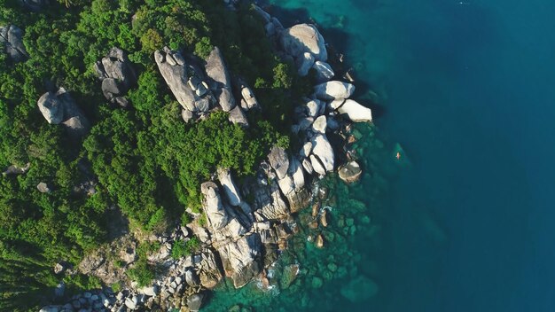 Top view of a rocky island clear water big stones Thailand