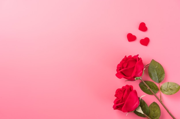 Top view of roses with heart as gift for Valentine day greeting.