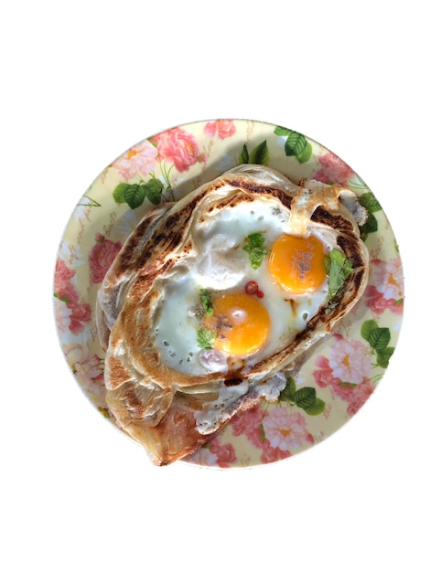 Top view of Roti Sarang Burung it is pratha looks like bird nest with half cook eggs in the middle