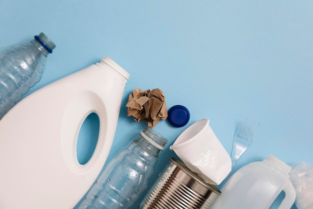 Top view of rubbish for recycling on a blue background