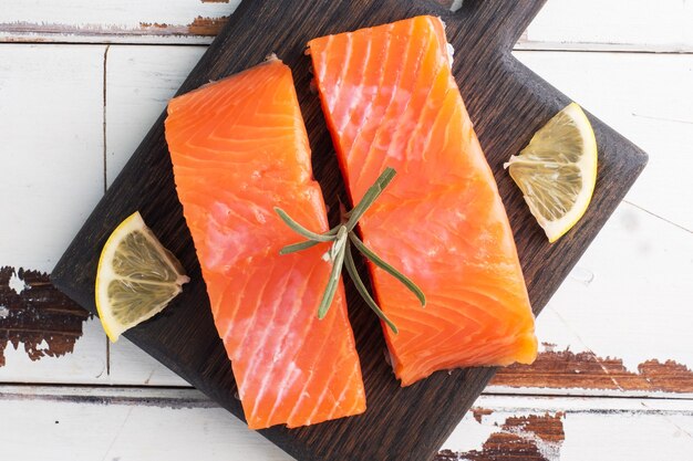 Top view salmon fillet on a wooden chopping board