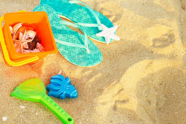 Top view of sandy beach with summer accessories